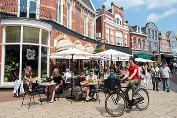 Enschede buildings with people socialising and bicycles