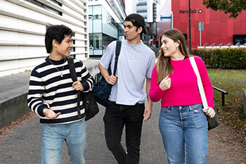 Students walking through campus and chatting