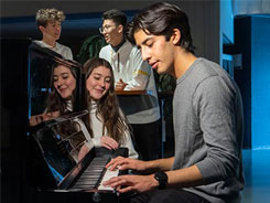 Gilberto playing the piano