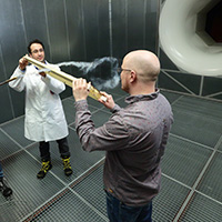Students and lecture in wind tunnel testing equipment